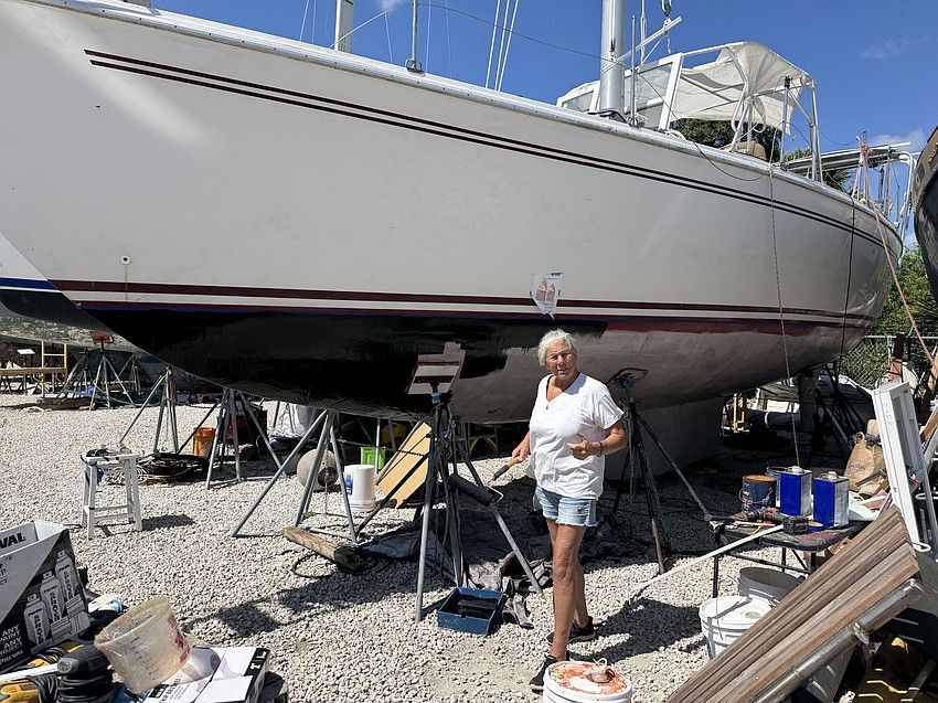Sally Lippert works on the boat. Sally Lippert works on the boat.