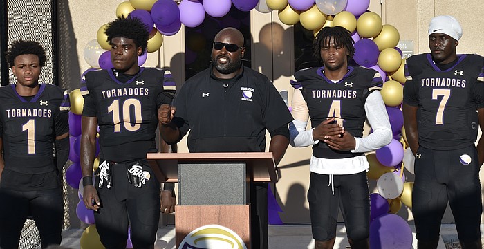 Carlos Woods (center) led Booker football to the FHSAA Class 3A state semifinals and a 12-2 record last season, but will not return for year two.