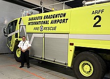 Sarasota-Bradenton International Airport Fire Department Chief Jason Hackley and one of the agency's three trucks with onboard tanks that hold 400 gallons of firefighting foam.