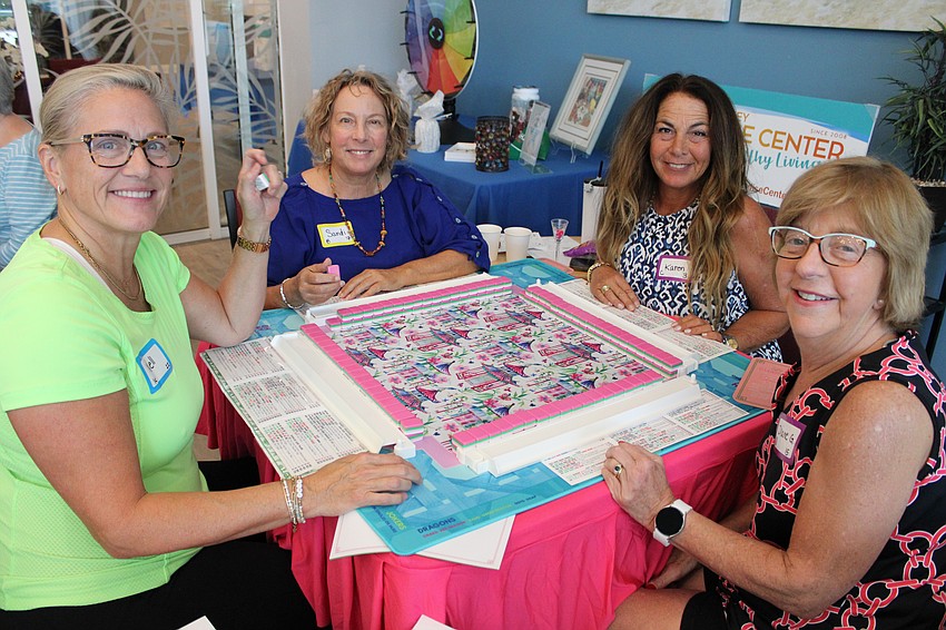 Players Nell Willis, Sandi Love, Karen Vito and Diane Gallo are all smiles for the Longboat Key Paradise Center's Mah Jongg Weekend.