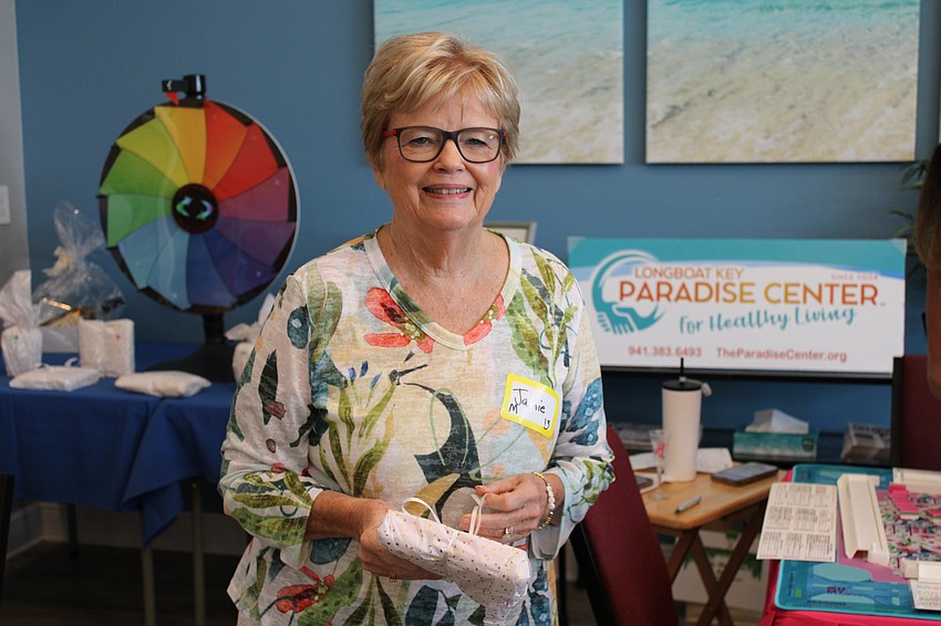 Jamie Engel smiles as she accepts her raffle prize.