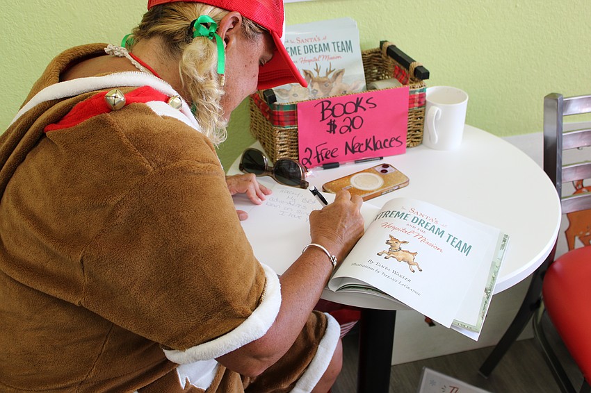 Tanya Waxler signing her book 