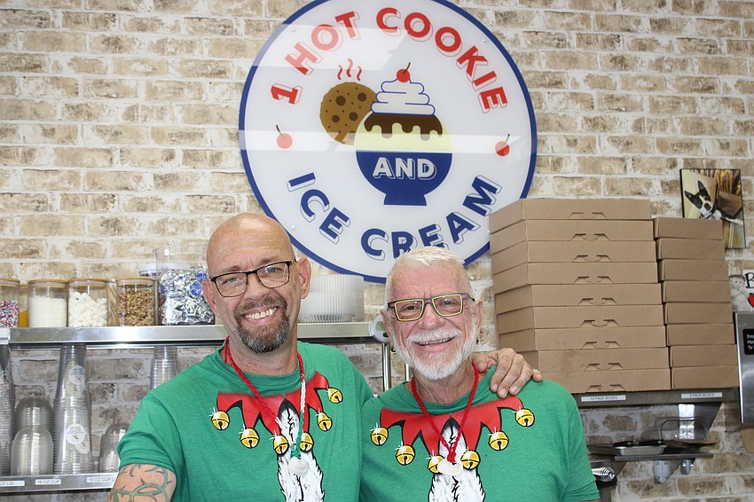The managing partners of 1 Hot Cookie and Ice Cream, Eric Turner and Stan Writesel, wore matching Christmas shirts to celebrate the Christmas in July book signing.