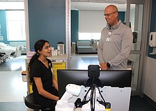 Guadalupe Barajas, an ICU nurse at Lakewood Ranch Medical Center, meets new CEO Jason Madsen for the first time in the new tower's ICU wing.
