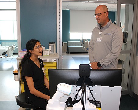 Guadalupe Barajas, an ICU nurse at Lakewood Ranch Medical Center, meets new CEO Jason Madsen for the first time in the new tower's ICU wing.