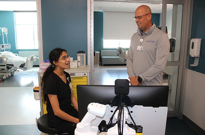Guadalupe Barajas, an ICU nurse at Lakewood Ranch Medical Center, meets new CEO Jason Madsen for the first time in the new tower's ICU wing.