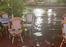 Water pooled around outdoor seating in front of Cha Cha Coconuts on the night of Thursday, July 23.