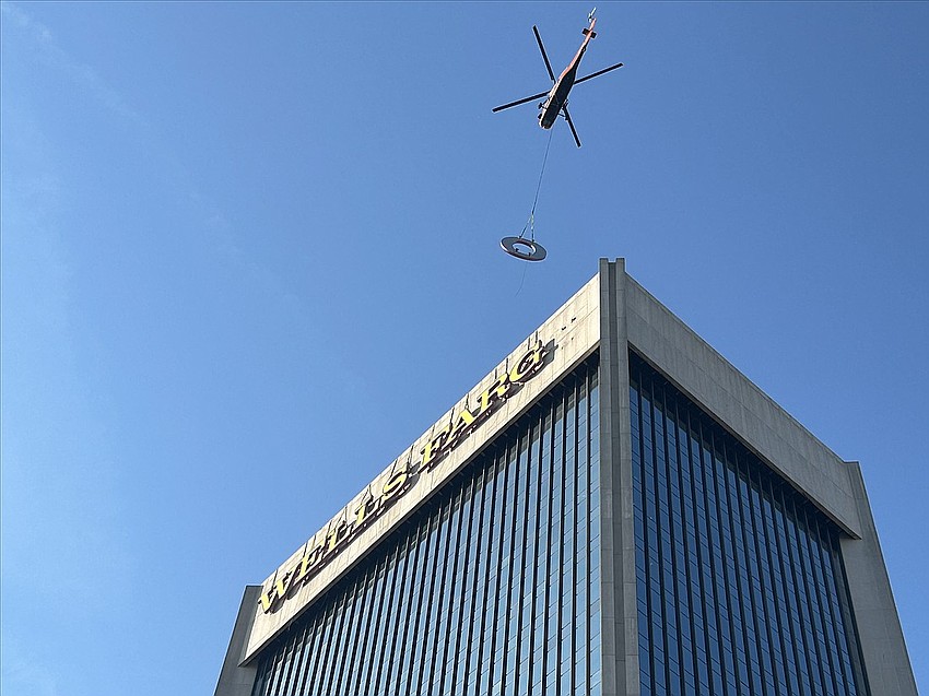 High Angle Services removes the letter O from what was called Wells Fargo Center in Downtown Jacksonville on July 14, 2024. The building is now called 1 Independent.