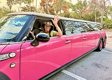 Christy James, owner of Longboat Key Flower Shop, is the driver of one of the island's most recognizable rides, a Barbie-pink limo.