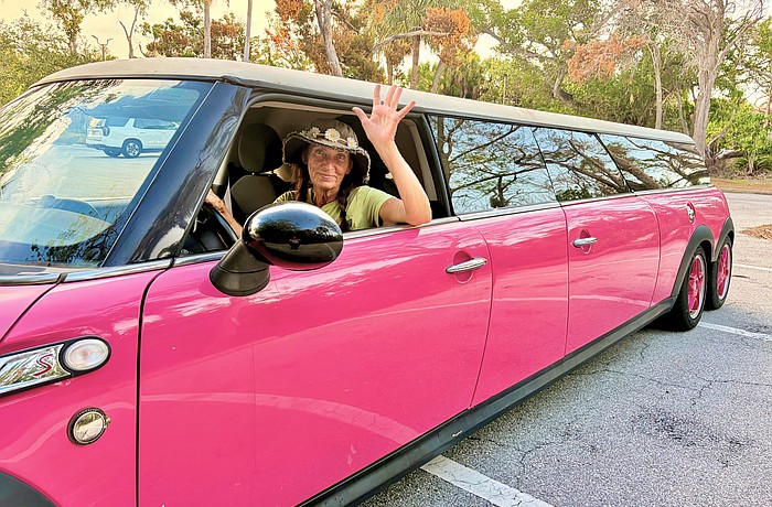 Christy James, owner of Longboat Key Flower Shop, is the driver of one of the island's most recognizable rides, a Barbie-pink limo.