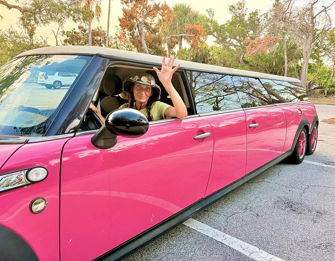 Christy James, owner of Longboat Key Flower Shop, is the driver of one of the island's most recognizable rides, a Barbie-pink limo.