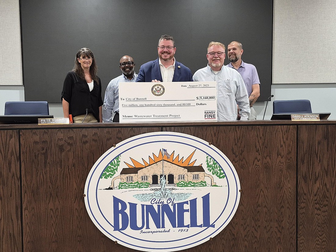 Congressman Randy Fine presents a ceremonial check for $5.16 million in federal funding to Bunnell officials for the city's Wastewater Treatment Plant Rehabilitation and Expansion Project. Courtesy photo