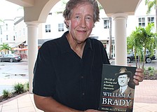 Country Club East's Mark Allen Baker shows off his newest book, "Willian A. Brady — The Life of a Boxing and Broadway Impresario."