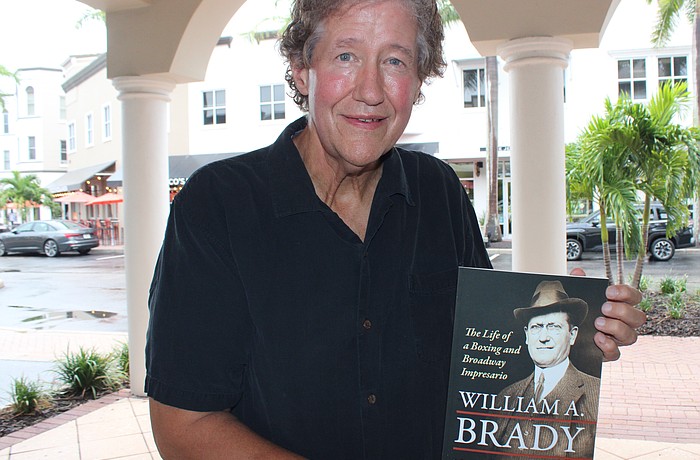 Country Club East's Mark Allen Baker shows off his newest book, "Willian A. Brady — The Life of a Boxing and Broadway Impresario."