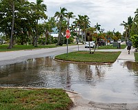 Water pools at the intersection in front of Mar Vista Dockside Restaurant in the Longboat Key Village neighborhood July 30.