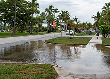 Water pools at the intersection in front of Mar Vista Dockside Restaurant in the Longboat Key Village neighborhood July 30.