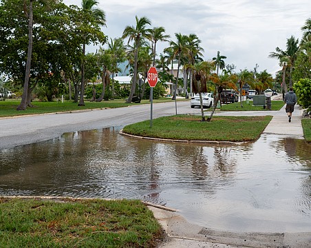 Water pools at the intersection in front of Mar Vista Dockside Restaurant in the Longboat Key Village neighborhood July 30.