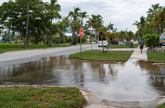 Water pools at the intersection in front of Mar Vista Dockside Restaurant in the Longboat Key Village neighborhood July 30.