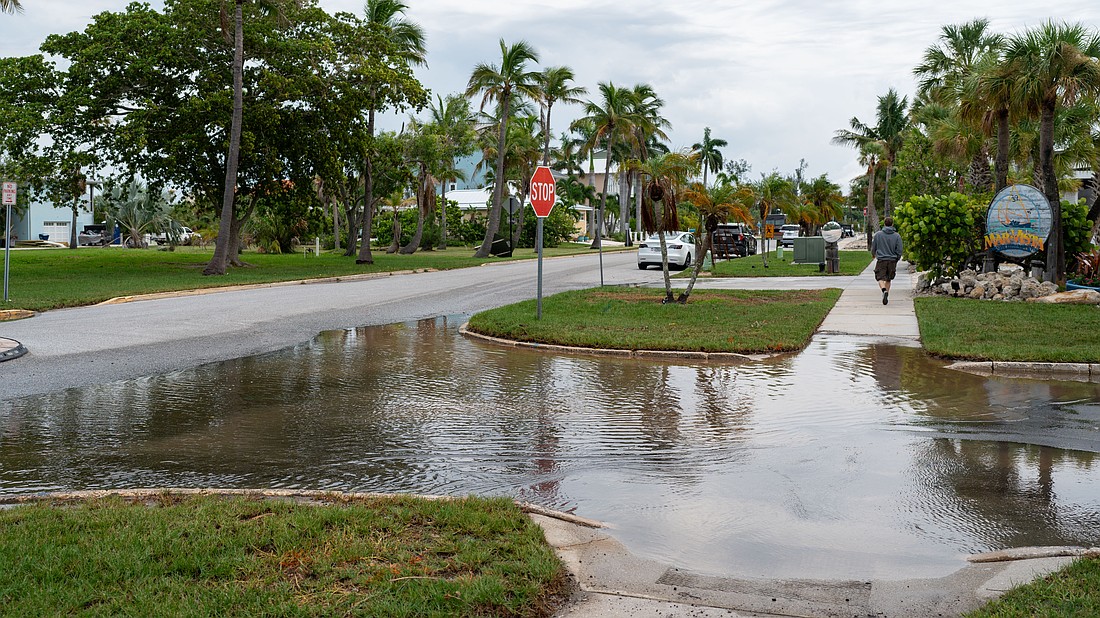Water pools at the intersection in front of Mar Vista Dockside Restaurant in the Longboat Key Village neighborhood July 30.