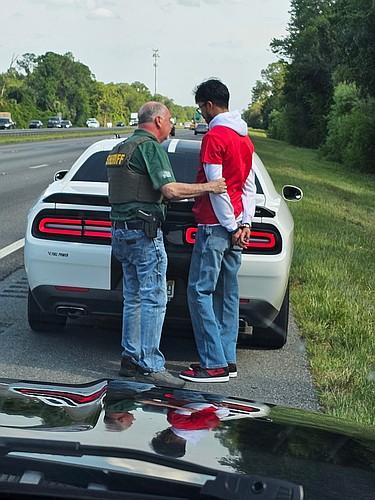 Sheriff Rick Staly arrests a Palm Coast man following a traffic stop on Interstate 95. Courtesy photo / FCSO