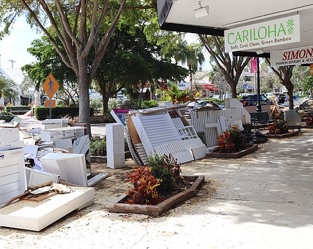 Storm debris piled up along streets across the city and St. Armands Circle for weeks following the 2024 hurricanes.