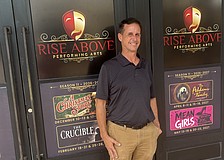 Rise Above Performing Arts Artistic Director Jacob Ruscoe stands in front of the theater company's new space.