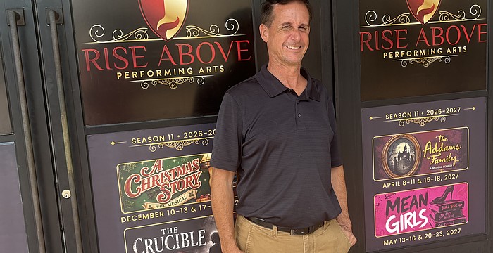 Rise Above Performing Arts Artistic Director Jacob Ruscoe stands in front of the theater company's new space.