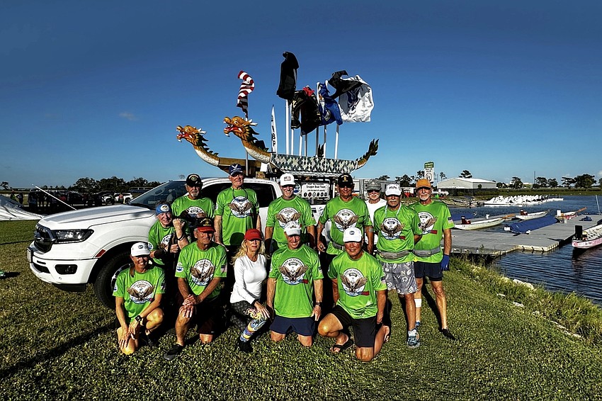 Members of the NBP Veterans team pose in front of Rickard Jensen's truck that doubles as a parade float. Members of the NBP Veterans team pose in front of Rickard Jensen's truck that doubles as a parade float.