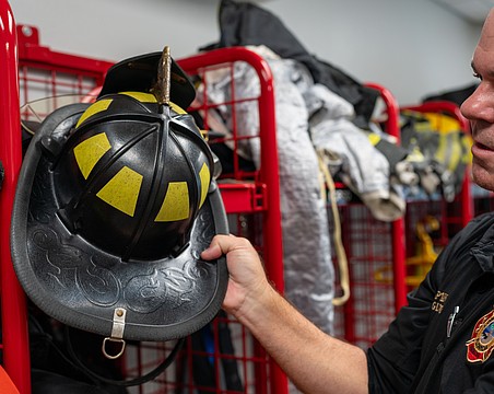 Longboat Key Fire Rescue Training Capt. David Eggleston said firefighter helmets have bills on the rear of the helmet so contaminated water can roll off without soaking into the jacket and pants firefighters wear while battling blazes.