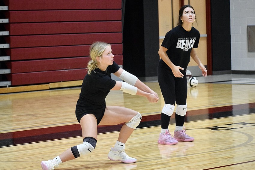 Rising sophomore Sami Tepfer (left) prepares to bump the ball while rising junior Samantha Gibson (right) watches. Both of them will be new on varsity this fall. Rising sophomore Sami Tepfer (left) prepares to bump the ball while rising junior Samantha Gibson (right) watches. Both of them will be new on varsity this fall.