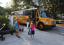 Kids arrive by bus at Southside Elementary. School begins Monday in Sarasota County.