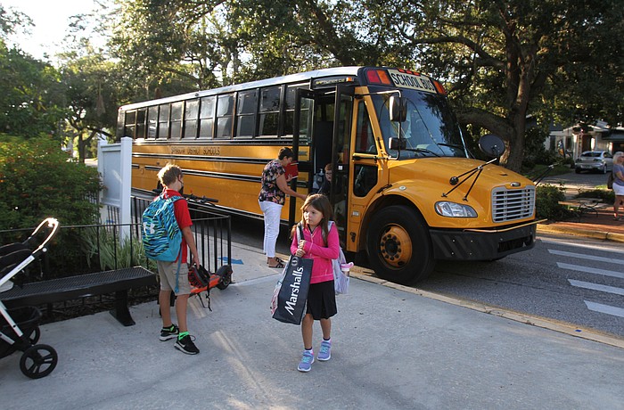 Kids arrive by bus at Southside Elementary. School begins Monday in Sarasota County.