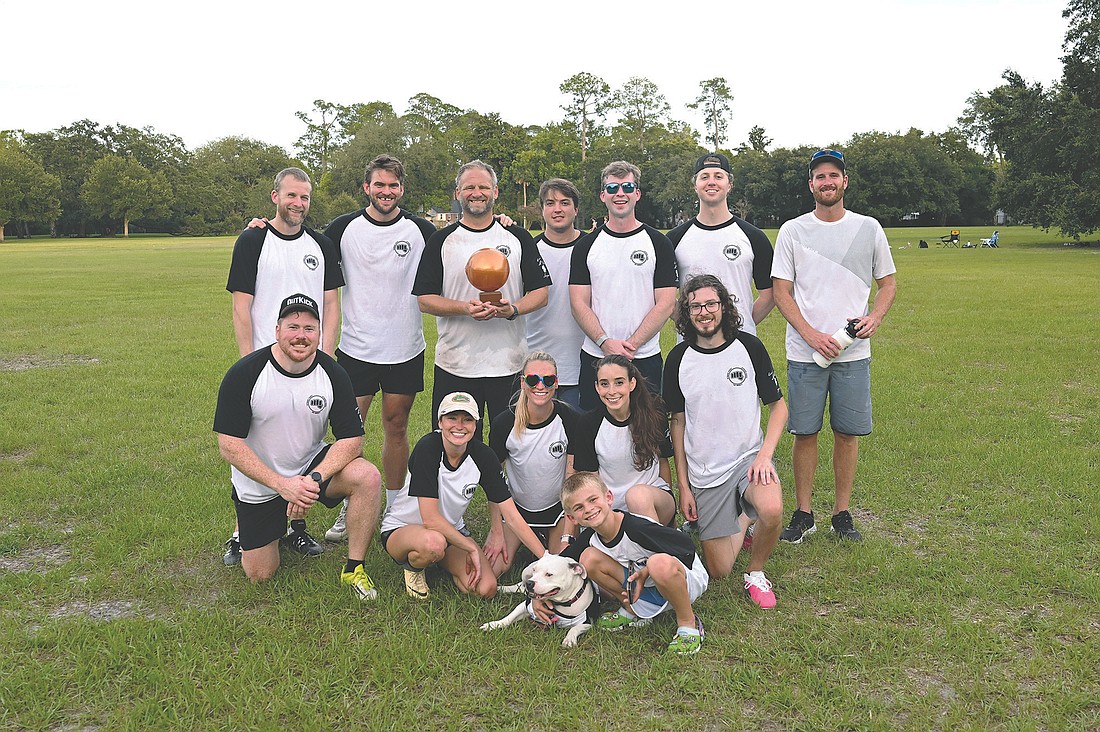The Ballbarians are the 2026 Jacksonville Bar Associaton Young Lawyers Section Kickball League champions. Back row, from left: Garth Cheek, Tucker Norton, John Weedon, Sam Beltrami, James McCauley, John Pairitz and Paul Palasz. Middle row: Jason Love, Rachel Learn, Clare Kelly, Julianna Favale and Jacob Abel. Front row: Miss Petal Pig Kelly and Beau Weedon. Not pictured: Allana Forte, Corie Powell, Nick Concilla, Taylor Collins, Kimano Edwards, Brendan Kolbinsky, Bobby Seifert, Adina Pollan, Carly Hazelip and Gigi Rivera.