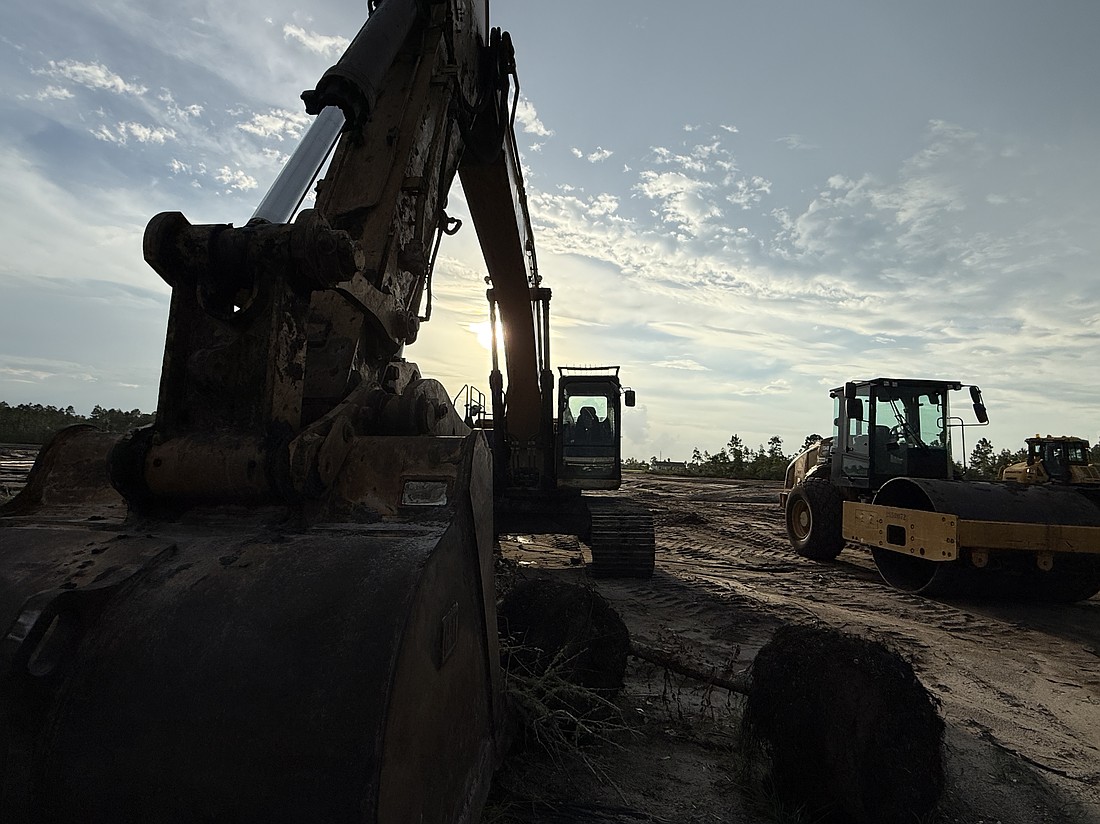 Heavy equipment sits at the Loop Road construction site. Photo By Brian McMillan