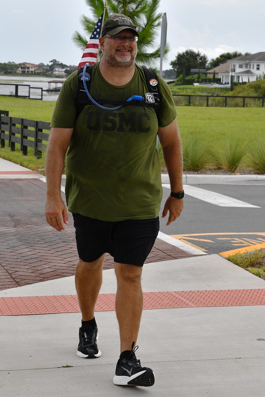 U.S. Marine Corps veteran Sgt. Chris Usher walked 22 miles, doing 22 push-ups and 22 squats every 2.2 miles, in honor of the 22 veterans who take their lives each day. U.S. Marine Corps veteran Sgt. Chris Usher walked 22 miles, doing 22 push-ups and 22 squats every 2.2 miles, in honor of the 22 veterans who take their lives each day.