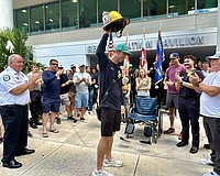 Lt. Clay Huber was cheered by about 100 first responders and hospital personnel on Thursday.