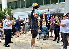 Lt. Clay Huber was cheered by about 100 first responders and hospital personnel on Thursday.