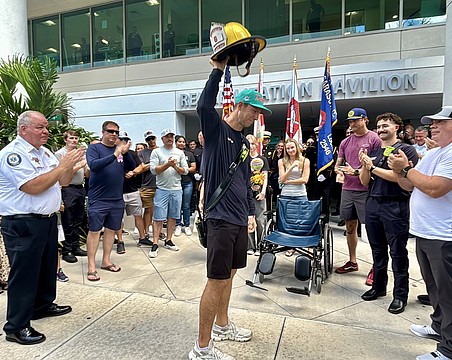 Lt. Clay Huber was cheered by about 100 first responders and hospital personnel on Thursday.