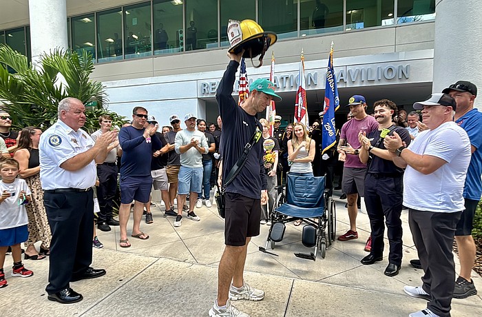 Lt. Clay Huber was cheered by about 100 first responders and hospital personnel on Thursday.