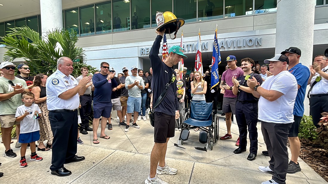 Lt. Clay Huber was cheered by about 100 first responders and hospital personnel on Thursday.