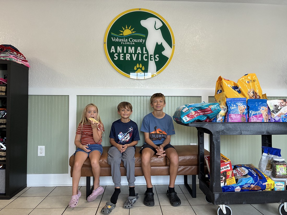 The siblings donated pet food to Volusia County Animal Services on Wednesday, Aug. 5. Courtesy photo