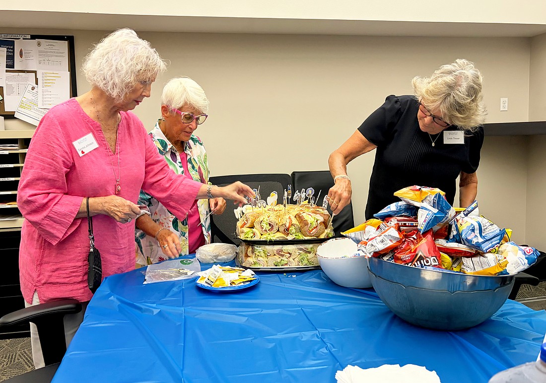 Sandra Johnson, Connie DiMaggio and Linda Theuer put finishing touches on the lunch they and fellow Longboat Island Chapel volunteers provided to Longboat Island Police officers on Thursday. It is Longboat Key Fire Rescue's turn on Wednesday.