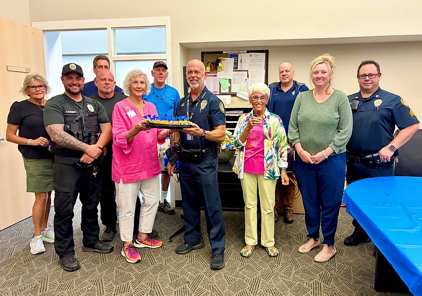 From left, Linda Theuer, Gregg Pescuma, Larry Theuer, Justin Ramsaier, Sandra Johnson, David Stone, Chief Russ Mager, Connie DiMaggio, Ivan Zunz, Taylor McLelland and Sean Butler.