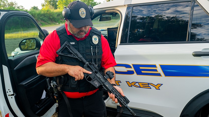 Longboat Key police officer Dexter Nazareno shows off the LKPD service rifle, a Smith and Wesson M&P 15.