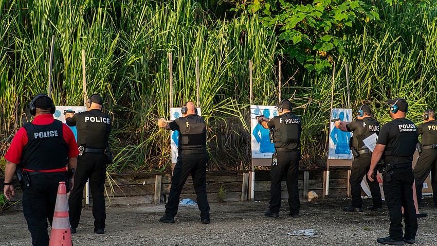 Longboat Key police officers shoot at targets close range at the old Bradenton Police Department firing range in rural Manatee County for annual firearm training Thursday, Aug. 6.