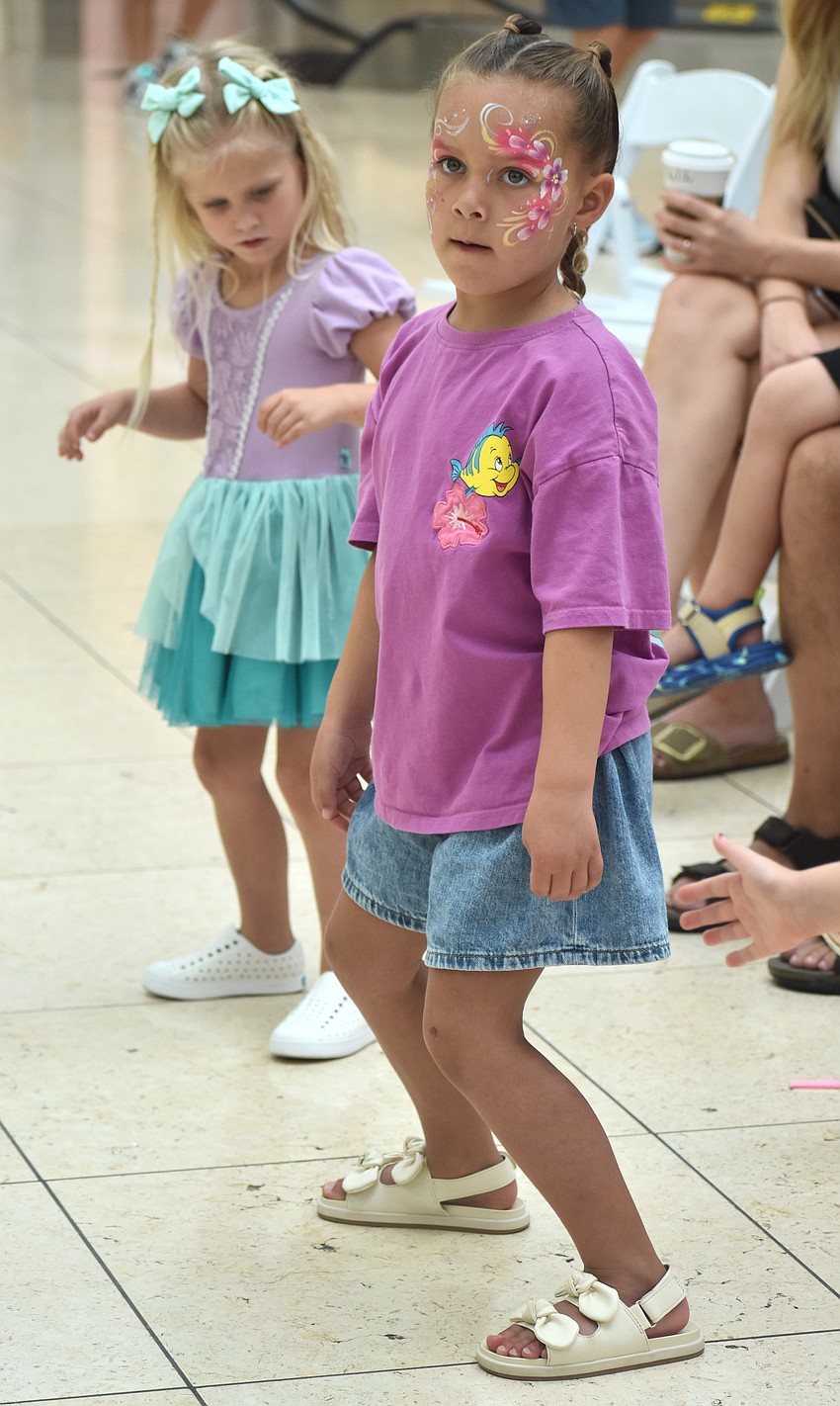 Parrish's Nova DiSalle (back) and Sarasota's Evelyn Oliver (front), both 4 years old, follow directions on how to dance from the Sarasota Ballet at the Back to School Bash.