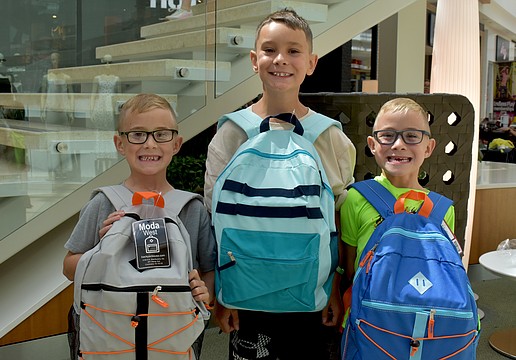 East County's Preston, Ashton and Clayton Nicholson are all eager to start their school year at Gene Witt Elementary School after attending the Back to School Bash at The Mall at University Town Center.