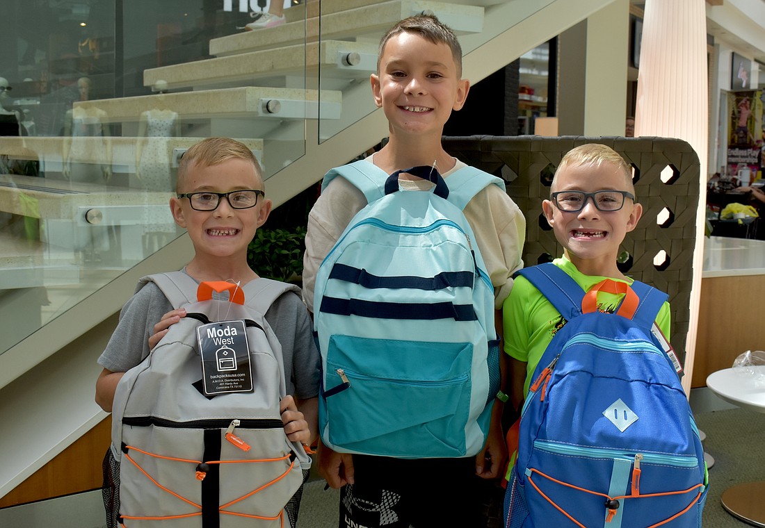 East County's Preston, Ashton and Clayton Nicholson are all eager to start their school year at Gene Witt Elementary School after attending the Back to School Bash at The Mall at University Town Center.