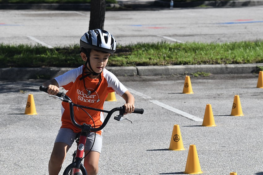 Dean Malucci, 6, rides the course at Sarasota BMX.