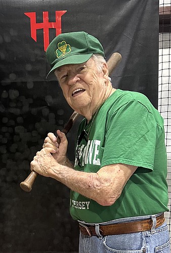 Palm Coast resident Robert "Chick" McGuire, 92, a softball player for 14 years in Bayonne, New jersey, picked up his old bat for the first time in over 60 years and took some swings at Hit House Academy indoor batting cage facility. Courtesy photo/Joan Soldano